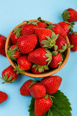 juicy fresh strawberry on a delicately blue background
