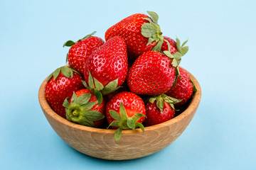 juicy fresh strawberry on a delicately blue background