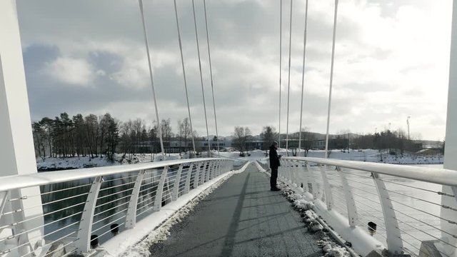Snekkarberget bru in Levanger, Norway, standing man