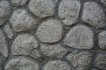 imitation of stone from cement, garden design on the wall
