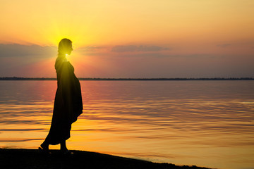 Pregnant woman on beach