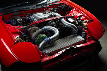 Car maintenance series: Red sport car engine bay - obrazy, fototapety, plakaty