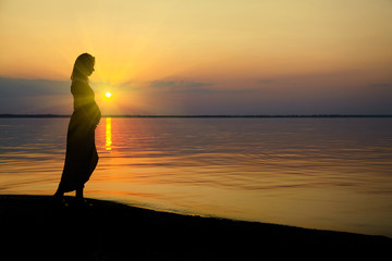 Fototapeta premium Pregnant woman on beach