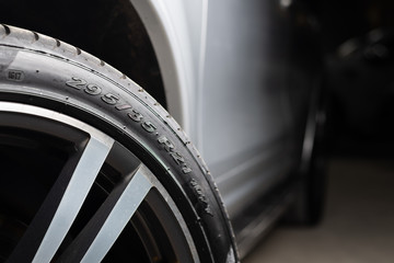 Car detailing series: Clean tire side wall - obrazy, fototapety, plakaty
