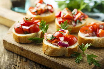 Tomato bruschetta with red onion and parsley