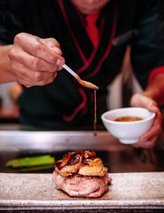 Dripping gravy sauce on Fillet mignon steak with Foie Gras