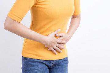 asian woman having stomachache on white background