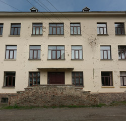 Fototapeta na wymiar Traditional classic European soviet school building facade with windows