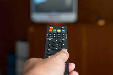 Remote TV in hand