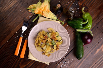 Zucchini flower omelette with potatoes and onion - 