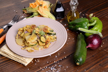 Zucchini flower omelette with potatoes and onion - 