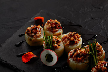 close-up view of delicious sushi roll with creamy eel and kimchi mayonnaise
