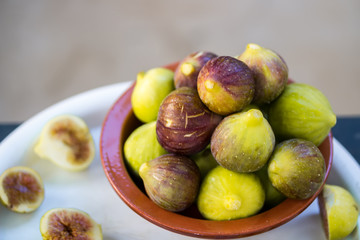 fresh figs in the clay bowl close-up, Apulia, Italian fruit