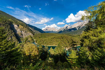 Fototapeta na wymiar Zugspitze Peak and Blindsee small Alpine Lake - Austria and Germany