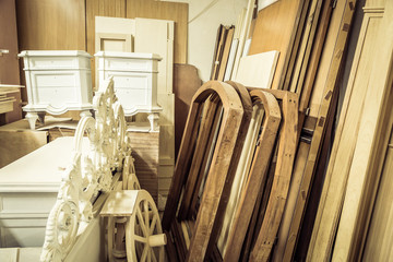 Wooden  furniture in a storehouse. Paint and varnish furniture