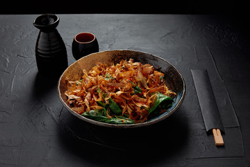 delicious japanese meal with katsuobushi, dried bonito shavings, chopsticks and sake
