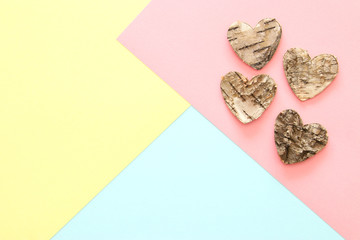 Abstract pastel colored paper texture. Minimal geometric shapes and lines. trendy design concept. wooden heart shapes