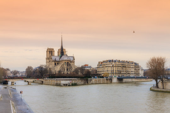 Beautiful sunset at the river Seine with the Notre-Dame Cathedral in Paris 