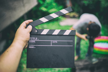 Clapper board,Movie clapper in hand and make movie background blu