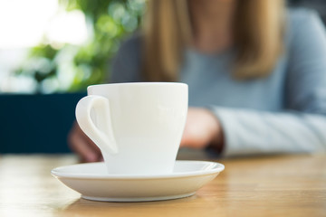 Blonde woman with white coffee