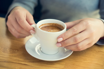 Blonde woman with white coffee