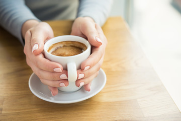 Blonde woman with white coffee