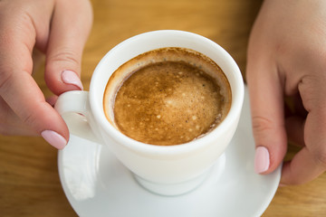 Blonde woman with white coffee