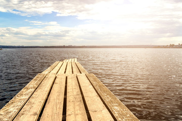 Wooden pier on the background of the sea