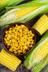 Ripe corn on a wooden table.