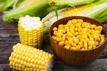 Ripe corn on a wooden table.