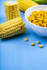 Ripe corn on a blue table