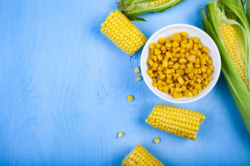 Ripe corn on a blue table