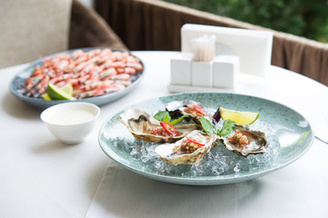 oysters and shrimp plate on the table