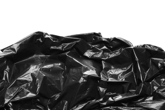 Crumpled, black plastic bag, isolated on white background, design elements, side view