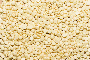 depilatory pearly yellow  solid wax beans  background