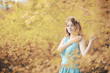 Young girl on a walk in the autumn 