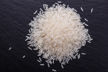 Jasmine rice on a dark stone background