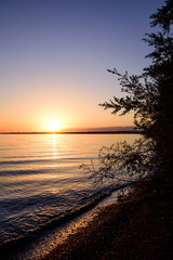Fototapeta na wymiar Sunset on a mountain lake
