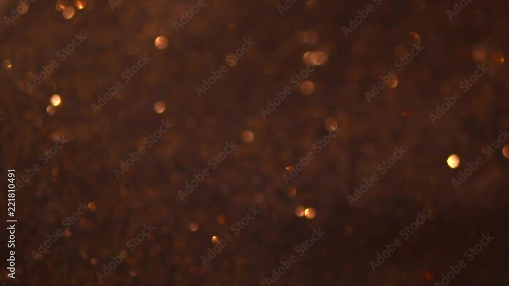 Sticker Glitter golden sparkles background. Gold glitter dust backdrop. Holiday background. 4K UHD video 3840x2160