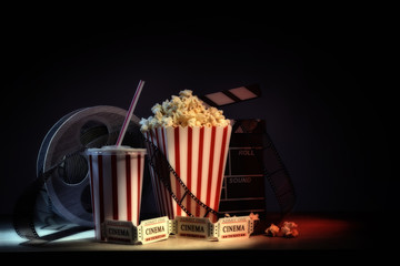 Fototapeta premium Vintage equipment and elements of cinema with dark background horizontal