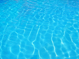 Fototapeta na wymiar Surface of blue swimming pool, Background of water in swimming pool.