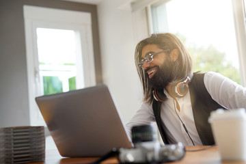 Artist working on laptop computer