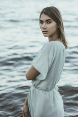 Fashion portrait of a beautiful, sensual girl on the sea