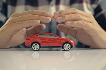 Male hands and car as protection of car concept