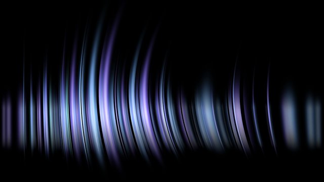 Abstract image of blurred blue and white lights on a black background