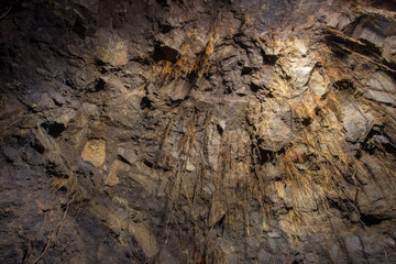 Underground abandoned gold iron ore mine shaft tunnel gallery passage with timbering wooden