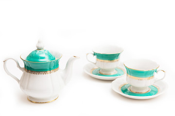 set of dishes on white background. Cups and kettle. Indian set.