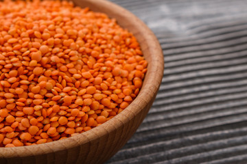 raw lentils on a wooden rustic background