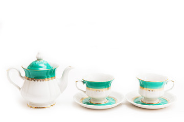 set of dishes on white background. Cups and kettle. Indian set.