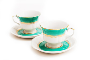 set of dishes on white background. Green indian cups